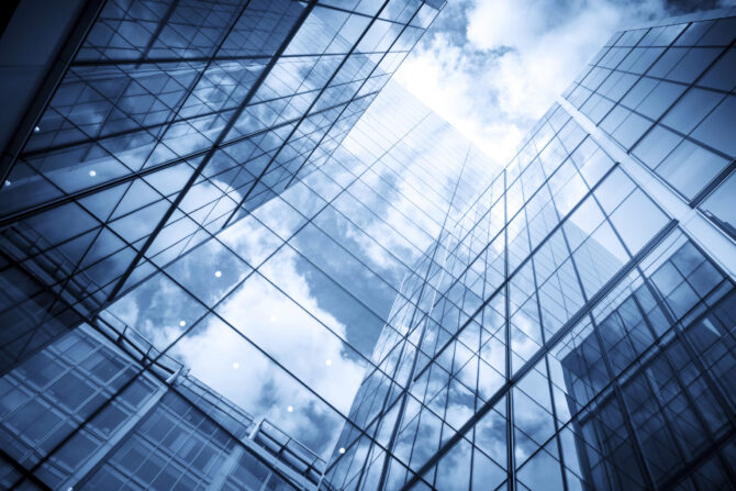 skyscraper reflecting the blue sky and clouds
