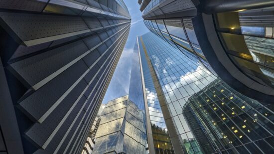 Low angle view looking down Lime Street to Lloyds of London Building, The Scalpel Building, Willis Building and The Leadenhall Building in the City of London UK