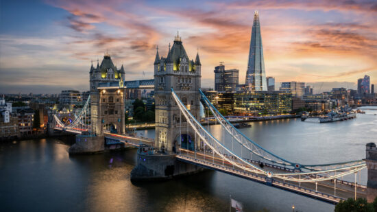 View Of Bridge Over River Against Cloudy Sky